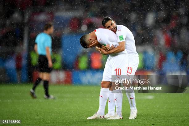 Granit Xhaka and teammmte Ricardo Rodriguez of Switzerland celebrate victory folowing the 2018 FIFA World Cup Russia group E match between Serbia and...