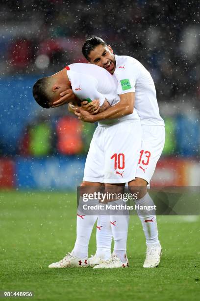 Granit Xhaka and teammmte Ricardo Rodriguez of Switzerland celebrate victory folowing the 2018 FIFA World Cup Russia group E match between Serbia and...