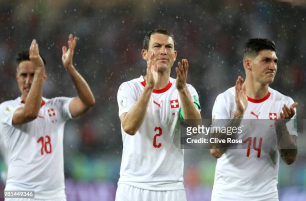 Stephan Lichtsteiner of Switzerland applauds fans following his sides victory in the 2018 FIFA World Cup Russia group E match between Serbia and...