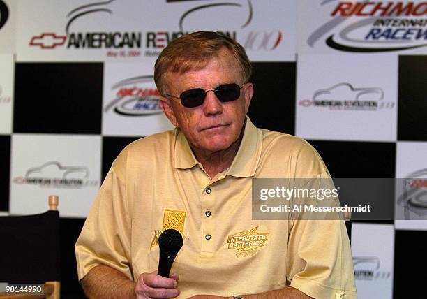 Washington Redskins football coach Joe Gibbs talks to the media before the NASCAR Nextel Cup Series Chevy American Revolution 400 at Richmond...