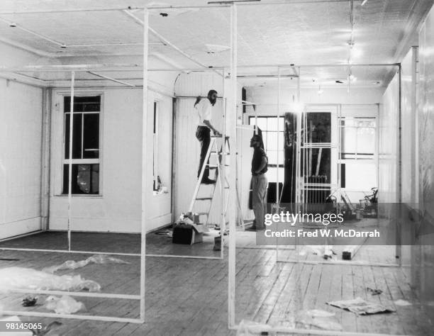 American performance artists Allan Kaprow and Robert Whitman set up an exhibition at the Ruben Gallery, New York, New York, August 5, 1959. The...