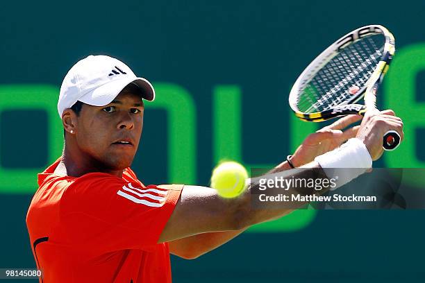 Jo-Wilfried Tsonga returns a shot against Juan Carlos Ferrero of Spain during day eight of the 2010 Sony Ericsson Open at Crandon Park Tennis Center...