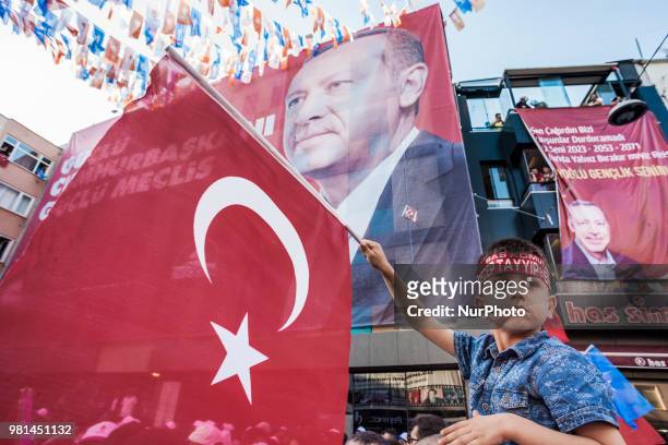 Boy holds a Turkey flag in a rally in support of Recep Tayyip Erdogan, candidate of the Justice and Development Party for the presidential elections...