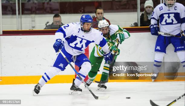 Minnetonka Skippers defenseman Grant Docter battles Edina Hornets defenseman Jake Boltmann for the puck during a prep hockey game at Ridder Ice Arena...