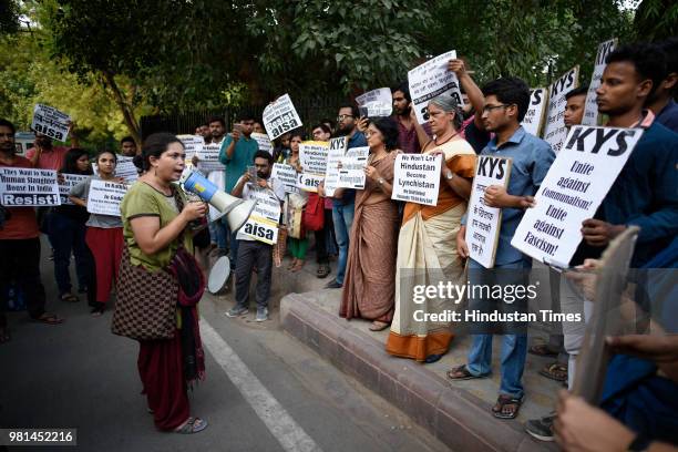 Members of All India Students Association hold placards as they protest against the mob lynchings in the country, at Parliament street, on June 22,...