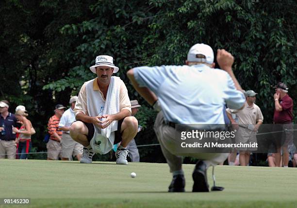 Mark Brooks and caddy line up a putt in the final round of the PGA Tour Bank of America Colonial in Ft. Worth, Texas, May 23, 2004.