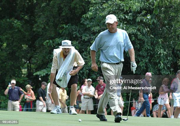 Mark Brooks and caddy line up a putt in the final round of the PGA Tour Bank of America Colonial in Ft. Worth, Texas, May 23, 2004.