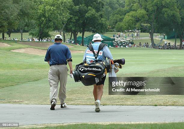 Loren Roberts walks the fairway with his caddy during the final round of the PGA Tour Bank of America Colonial in Ft. Worth, Texas, May 23, 2004.