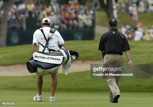 Joe Ogilvie walks the fairway with his caddy in the final round of the PGA Tour Bank of America Colonial in Ft. Worth, Texas, May 23, 2004.