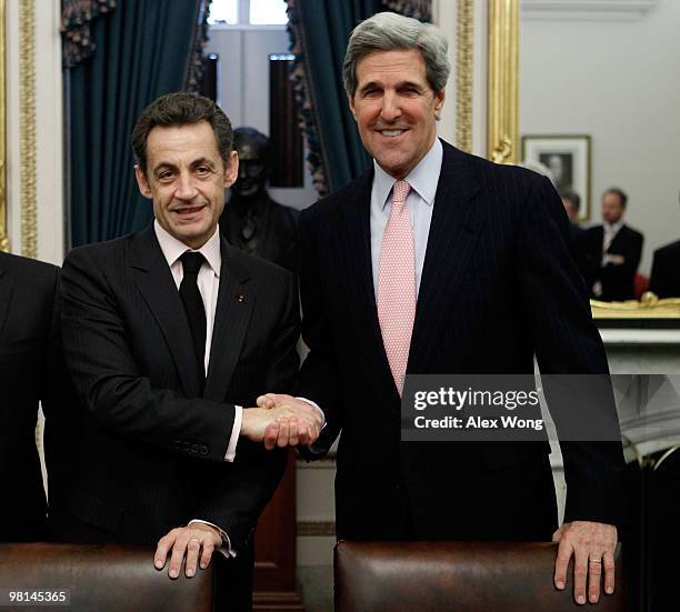 Sen. John Kerry shakes hands with French President Nicolas Sarkozy at the beginning of their meeting on Capitol Hill March 30, 2010 in Washington,...