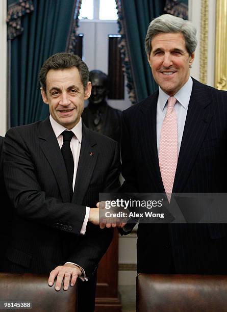 Sen. John Kerry shakes hands with French President Nicolas Sarkozy at the beginning of their meeting on Capitol Hill March 30, 2010 in Washington,...