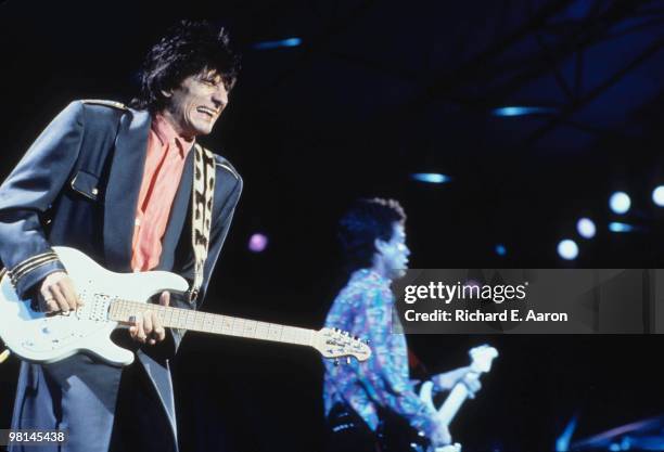 Ronnie Wood and Mick Jagger from The Rolling Stones perform live on stage at the Memorial Coliseum in Los Angeles in October 1989