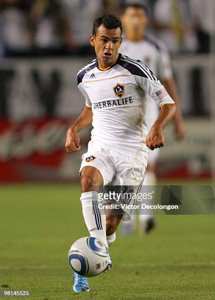 Juninho of the Los Angeles Galaxy passes the ball on the attack in the second half during their MLS match against the New England Revolution at the...