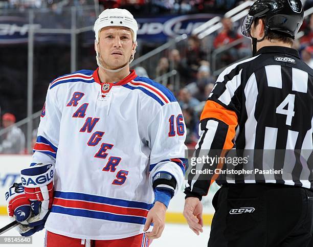 Sean Avery of the New York Rangers has a conversation with NHL referee Wes McCauley during the third period in the game against the New Jersey Devils...