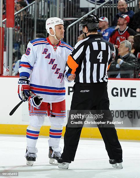 Sean Avery of the New York Rangers has a conversation with NHL referee Wes McCauley during the third period in the game against the New Jersey Devils...