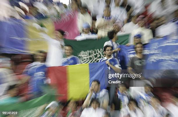 Saudi club Al-Hilal supporters cheer their team against Emirati Al-Ahli club opponents during their AFC Champions League Group D football match in...