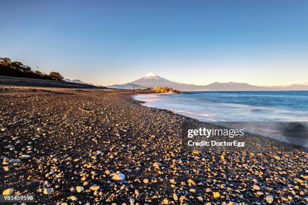 mt. fuji in winter sunset at miho no matsubara beach, shizuoka, japan - doctoregg stock pictures, royalty-free photos & images