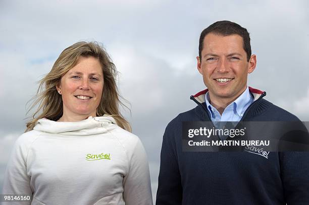 British sailor Samantha Davies and French Romain Attanasio pose on March 30, 2010 in Paris, during a press conference to present the sailors ahead of...