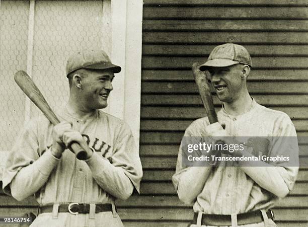 Rogers Hornsby of the St. Louis Browns talks with Joe Dugan of the Philadelphia Athletics before a spring training game in Lake Charles, Louisiana in...