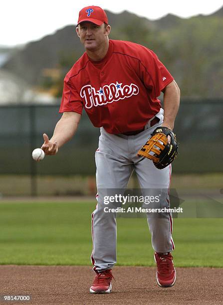 Philadelphia Phillies first baseman Jim Thome tosses a ball during spring training February 24, 2005 in Clearwater, Florida.