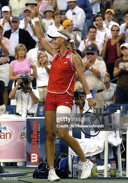 Elena Dementieva waives to fans after defeating Jennifer Capriati in the sem- finals of the women's singles September 10, 2004 at the 2004 US Open in...