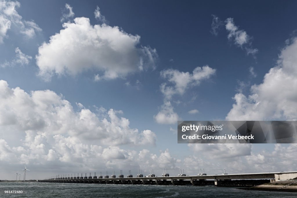 Bridge with wind turbines in background, Oosterscheldekering, Zeeland, Netherlands