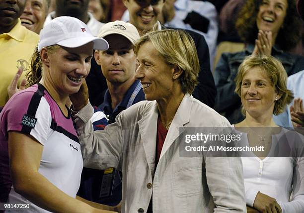 Svetlana Kuznetsova climbs into the stands to hug tennis great Martina Navratilova after defeating Elena Dementieva, 6-3, 7-5, in an all-Russian,...