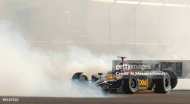 Andretti Green Racing teammates Bryan Herta and Tony Kanaan spins their tires and burn rubber to celebrate a team sweep of the 2005 Honda Grand Prix...