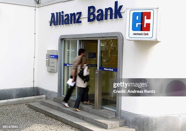 Customers walk in an Allianz bank on March 30, 2010 in Berlin, Germany. Allianz focused on their core market Germany under the brand name Allianz...