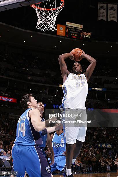 Johan Petro of the Denver Nuggets takes the ball to the basket against Eduardo Najera of the Dallas Mavericks during the game on February 9, 2010 at...