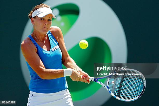 Agnieszka Radwanska of Poland returns a shot against Venus Williams of the United States during day eight of the 2010 Sony Ericsson Open at Crandon...