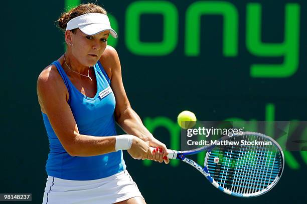 Agnieszka Radwanska of Poland returns a shot against Venus Williams of the United States during day eight of the 2010 Sony Ericsson Open at Crandon...