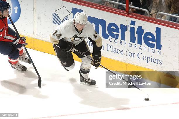 Chris Kunitz of the Pittsburgh Penguins skates with the puck during a NHL hockey game against the Washington Capitals on March 24, 2010 at the...
