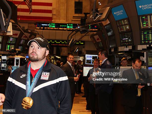 Steve Holcomb, pilot of the gold medal winning United States four-man bobsled team, visits the New York Stock Exchange on March 30, 2010 in New York...