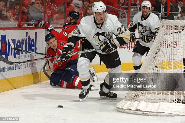 Craig Adams of the Pittsburgh Penguins skates with the puck during a NHL hockey game against the Washington Capitals on March 24, 2010 at the Verizon...