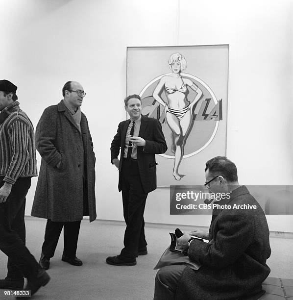 On an episode of the television documentary news program 'Eye on New York,' patrons smile at an off-camera painting at the 'First International...