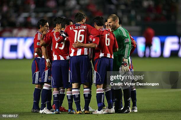 Sacha Kljestan of Chivas USA and his teammates huddle together prior to their MLS match against the Colorado Rapids at the Home Depot Center on March...