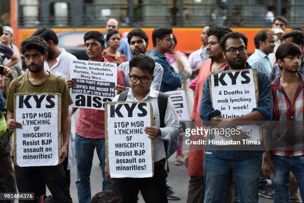 Members of All India Students Association hold placards as they protest against the mob lynchings in the country, at Parliament street, on June 22,...