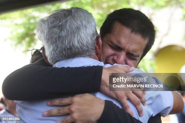 Man -who had been arrested in recent protests- is embraced by a relative after being released from jail in Managua, Nicaragua on June 22, 2018. - Ten...