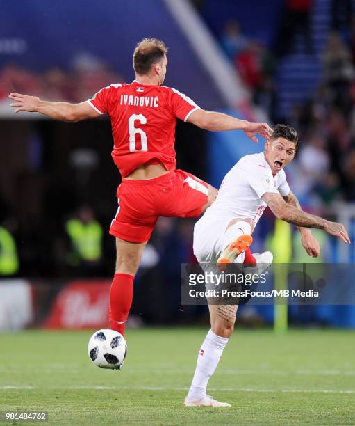 Branislav Ivanovic of Serbia competes with Steven Zuber of Switzerland during the 2018 FIFA World Cup Russia group E match between Serbia and...