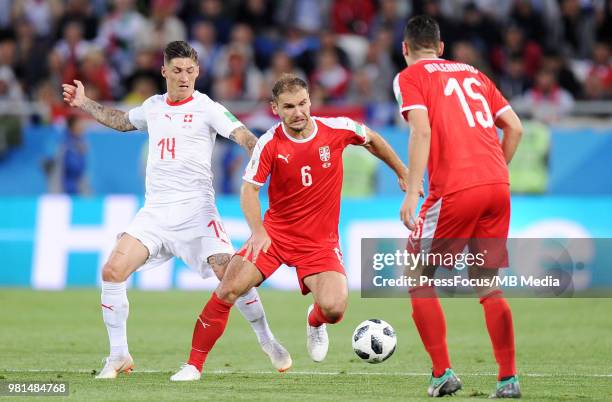 Steven Zuber of Switzerland competes with Branislav Ivanovic of Serbia during the 2018 FIFA World Cup Russia group E match between Serbia and...