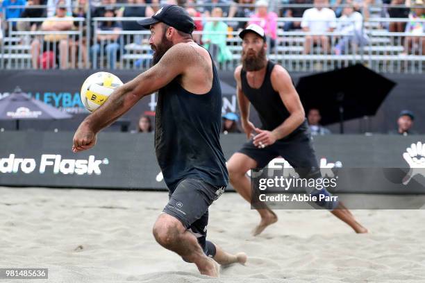 Riley McKibbin digs the ball alongside teammate Maddison McKibbin while competing against Casey Patterson and Stafford Slick during opening rounds of...