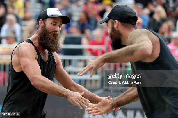 Riley McKibbin and Maddison McKibbin celebrate while competing against Casey Patterson and Stafford Slick during opening rounds of the AVP Seattle...