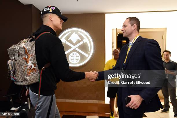 Michael Porter Jr. Shakes hands with general manager Arturas Karnisovas of the Denver Nuggets during a press conference on June 22, 2018 at the Pepsi...