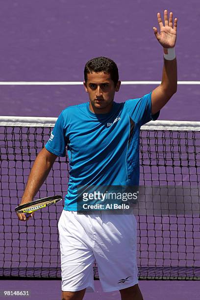 Nicolas Almagro of Spain celebrates after defeating Thomaz Bellucci of Brazil during day eight of the 2010 Sony Ericsson Open at Crandon Park Tennis...