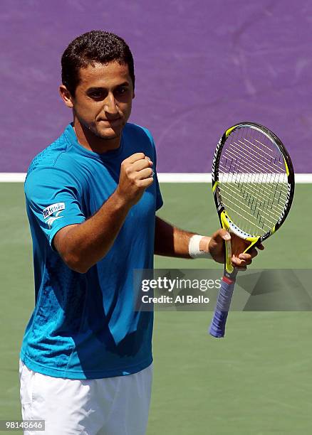 Nicolas Almagro of Spain celebrates after defeating Thomaz Bellucci of Brazil during day eight of the 2010 Sony Ericsson Open at Crandon Park Tennis...