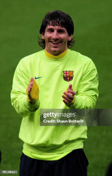 Lionel Messi of Barcelona smiles during a training session ahead of their UEFA Champions League quarter final first leg match against Arsenal at the...