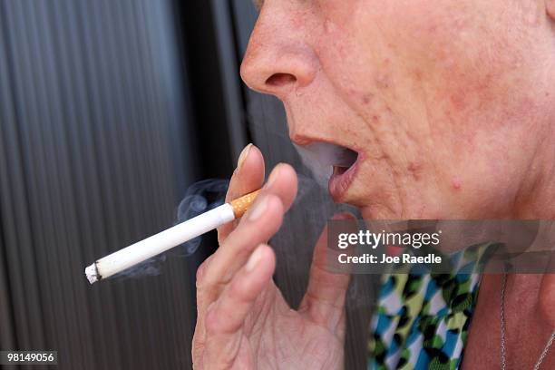 Brenda Wisehart smokes a menthol cigarette in front of a Quick Stop store on March 30, 2010 in Miami, Florida. Today in Washington, DC a public...