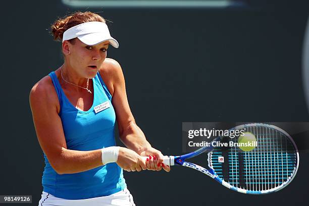 Agnieszka Radwanska of Poland returns a shot against Venus Williams of the United States during day eight of the 2010 Sony Ericsson Open at Crandon...