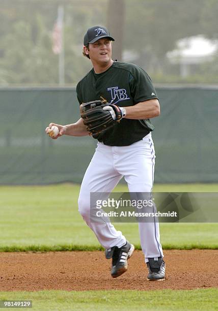 Tampa Bay Devil Rays infielder Sean Burroughs fields a ball at third base during practice at Raymond A. Naimoli baseball complex in St. Petersburg,...